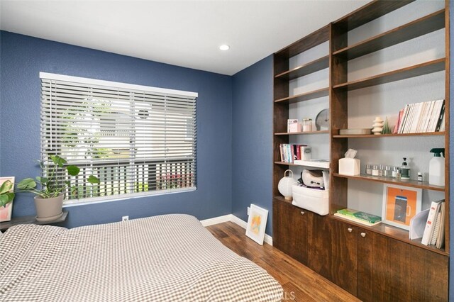 8718 E Indian Hills Rd Unit J, Orange, CA 92869 - bedroom featuring wood finished floors and baseboards