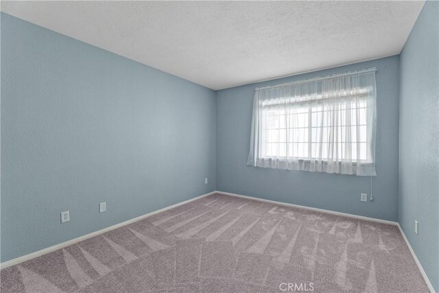 19192 Garcelon Ct, Apple Valley, CA 92308 - spare room featuring carpet floors and a textured ceiling