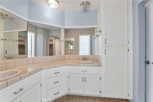 19192 Garcelon Ct, Apple Valley, CA 92308 - full bathroom featuring double vanity, wood finished floors, and a spacious closet