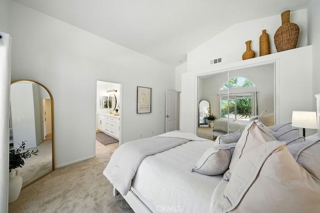 24322 Via Las Junitas, Murrieta, CA 92562 - bedroom with high vaulted ceiling, light colored carpet, arched walkways, ensuite bath, and access to outside
