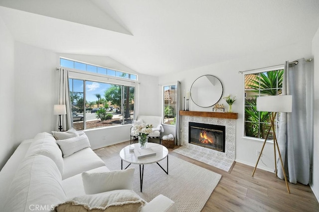 24322 Via Las Junitas, Murrieta, CA 92562 - living area with vaulted ceiling, wood finished floors, and a tile fireplace