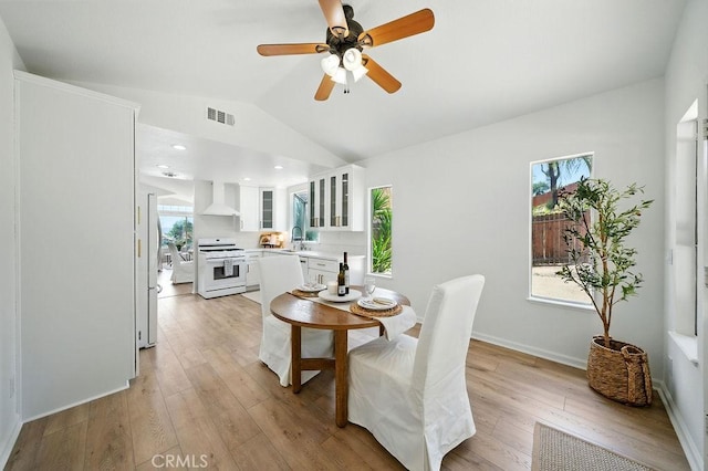 24322 Via Las Junitas, Murrieta, CA 92562 - dining room featuring plenty of natural light, light wood-type flooring, lofted ceiling, and ceiling fan