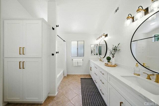 24322 Via Las Junitas, Murrieta, CA 92562 - full bathroom featuring double vanity, shower / bath combo with shower curtain, and tile patterned flooring