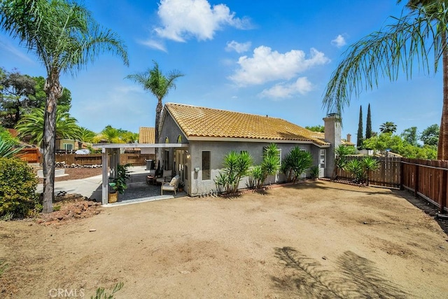 24322 Via Las Junitas, Murrieta, CA 92562 - back of house with stucco siding, a tile roof, and a patio