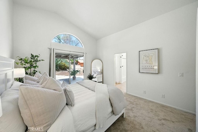 24322 Via Las Junitas, Murrieta, CA 92562 - carpeted bedroom with access to outside, high vaulted ceiling, and ensuite bath