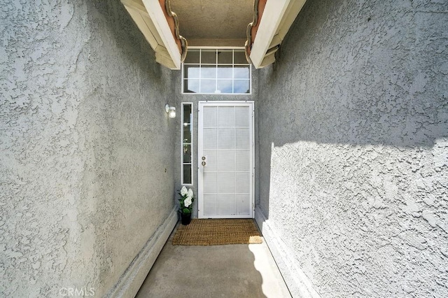 24322 Via Las Junitas, Murrieta, CA 92562 - doorway to property featuring stucco siding