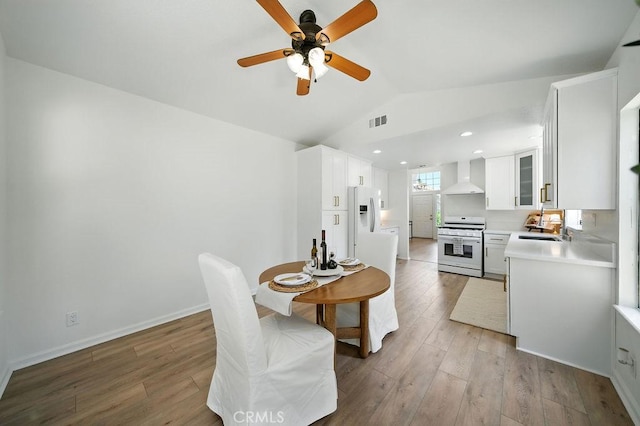 24322 Via Las Junitas, Murrieta, CA 92562 - dining area featuring lofted ceiling, ceiling fan, and light wood-style floors