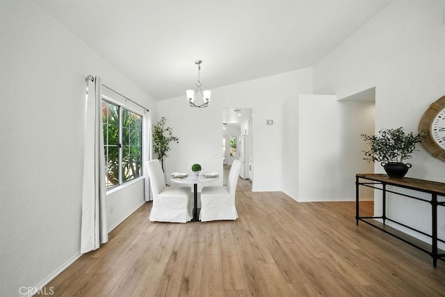 24322 Via Las Junitas, Murrieta, CA 92562 - dining area featuring a chandelier, vaulted ceiling, and light wood-type flooring