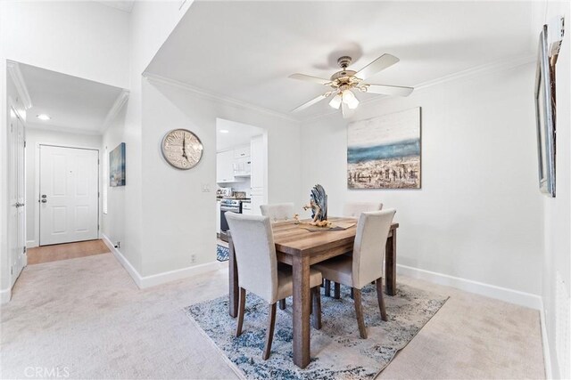25521 Indian Hill Ln Unit L, Laguna Hills, CA 92653 - dining area featuring light carpet, crown molding, ceiling fan, and recessed lighting