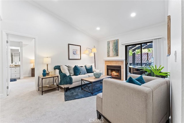 25521 Indian Hill Ln Unit L, Laguna Hills, CA 92653 - living room featuring light carpet, ornamental molding, a tiled fireplace, recessed lighting, and lofted ceiling