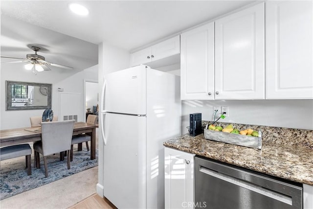 25521 Indian Hill Ln Unit L, Laguna Hills, CA 92653 - kitchen with freestanding refrigerator, stainless steel dishwasher, light stone counters, white cabinetry, and ceiling fan