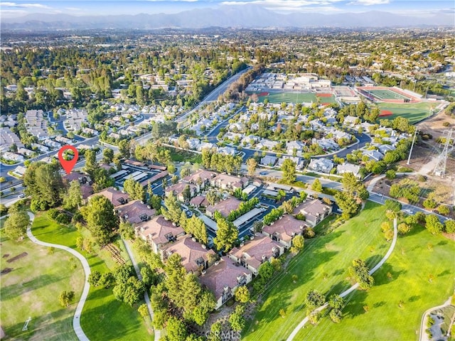 25521 Indian Hill Ln Unit L, Laguna Hills, CA 92653 - aerial view of property's location featuring a mountain backdrop and nearby suburban area