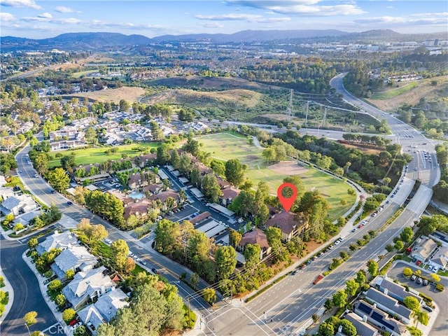25521 Indian Hill Ln Unit L, Laguna Hills, CA 92653 - aerial overview of property's location featuring a mountain backdrop and nearby suburban area