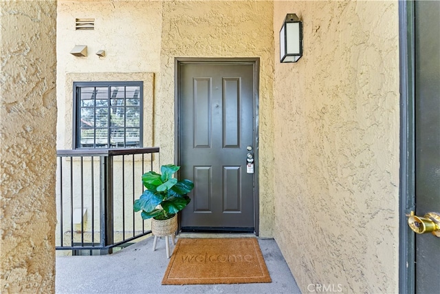 25521 Indian Hill Ln Unit L, Laguna Hills, CA 92653 - property entrance with stucco siding
