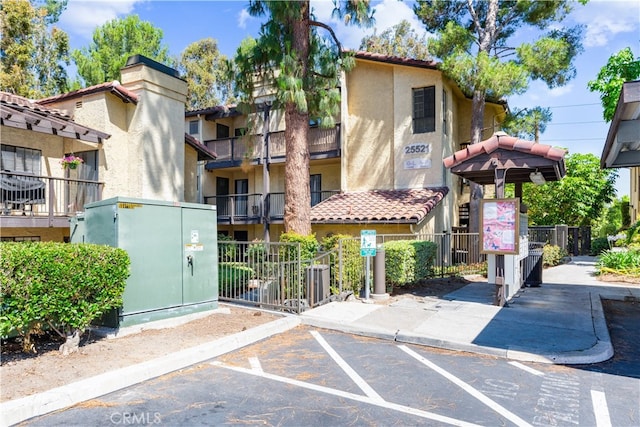 25521 Indian Hill Ln Unit L, Laguna Hills, CA 92653 - view of property with uncovered parking