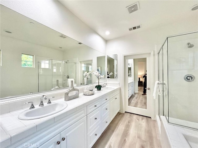 37 Roycroft, Irvine, CA 92620 - full bath with wood finished floors, double vanity, a shower stall, and connected bathroom