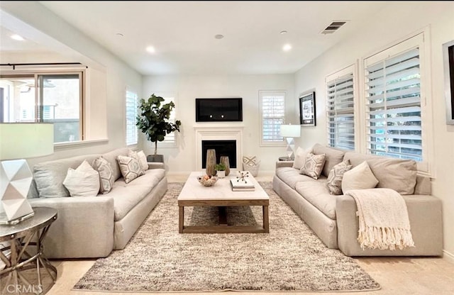 37 Roycroft, Irvine, CA 92620 - living room featuring plenty of natural light, a fireplace, and recessed lighting