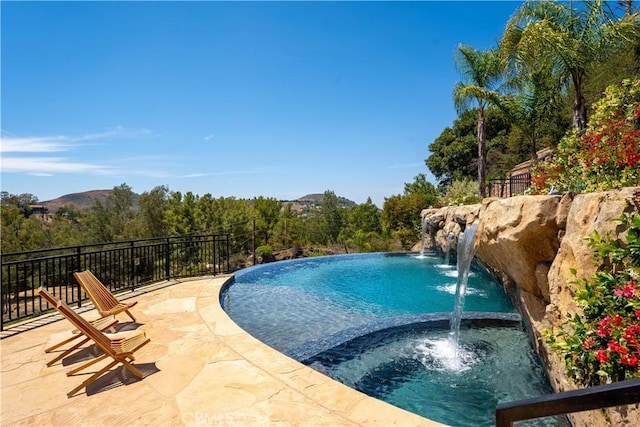 24410 Mulholland, Calabasas, CA 91302 - view of pool featuring a pool with connected hot tub
