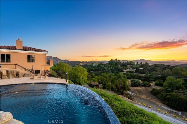 24410 Mulholland, Calabasas, CA 91302 - view of swimming pool with a mountain view