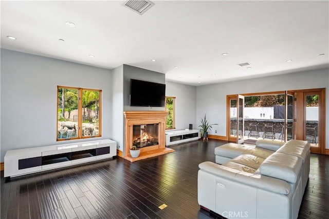 24410 Mulholland, Calabasas, CA 91302 - living room featuring a glass covered fireplace, recessed lighting, and wood finished floors