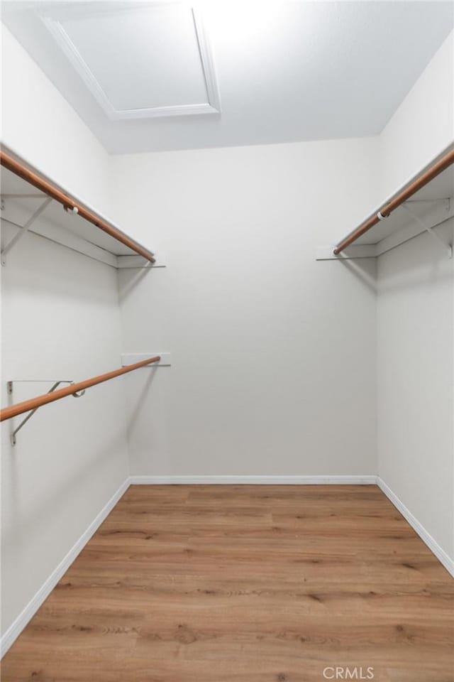 903 San Pablo Ave, Merced, CA 95348 - spacious closet with light wood-style floors and attic access