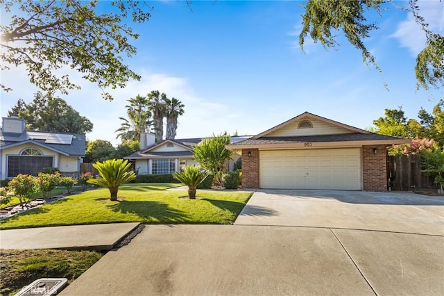 903 San Pablo Ave, Merced, CA 95348 - single story home with brick siding, driveway, and a garage