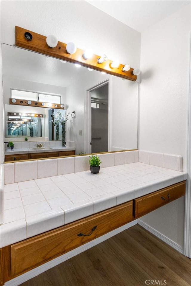 903 San Pablo Ave, Merced, CA 95348 - full bathroom with wood finished floors and vanity