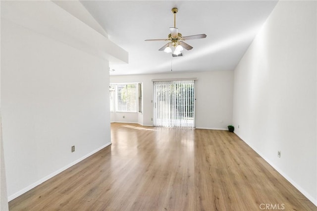 903 San Pablo Ave, Merced, CA 95348 - empty room featuring ceiling fan, light wood-type flooring, and vaulted ceiling