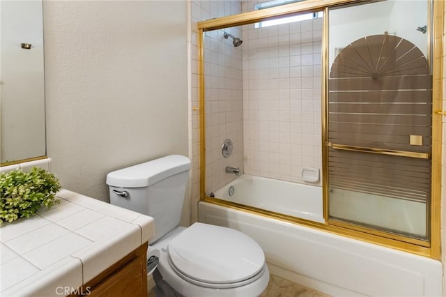 903 San Pablo Ave, Merced, CA 95348 - bathroom with vanity, shower / bath combination with glass door, and a textured wall