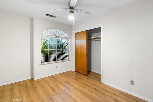 903 San Pablo Ave, Merced, CA 95348 - unfurnished bedroom with wood finished floors, a closet, and a ceiling fan