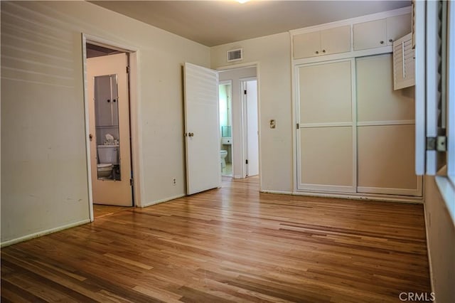 1230 N Mountain Ave, Claremont, CA 91711 - unfurnished bedroom with wood finished floors and a closet