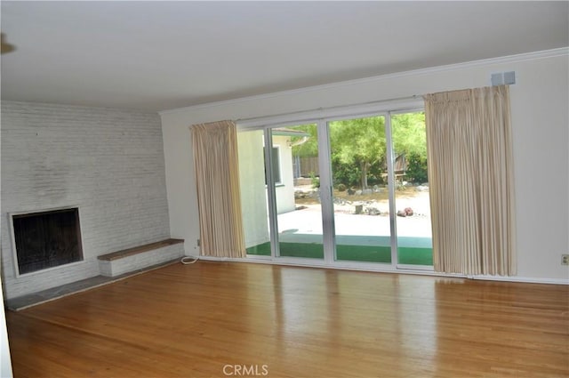 1230 N Mountain Ave, Claremont, CA 91711 - unfurnished living room featuring a fireplace, wood finished floors, and ornamental molding