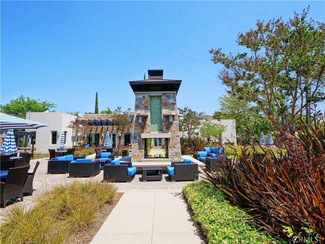 5429 Strand Unit 101, Hawthorne, CA 90250 - surrounding community featuring an outdoor living space and a patio area