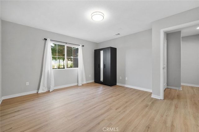 1016 W Baseline Rd, Claremont, CA 91711 - spare room with light wood-style flooring and baseboards