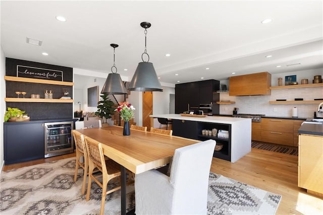 20 Whistling Isle, Irvine, CA 92614 - dining area featuring wine cooler, light wood-style flooring, recessed lighting, and a dry bar