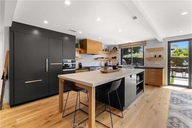 20 Whistling Isle, Irvine, CA 92614 - kitchen with open shelves, modern cabinets, dark cabinets, light wood-type flooring, and recessed lighting