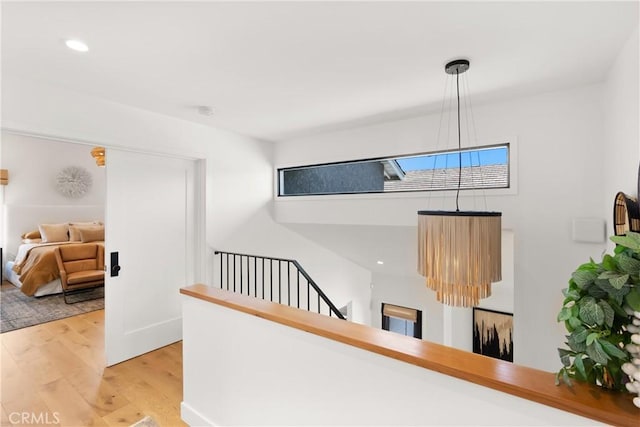 20 Whistling Isle, Irvine, CA 92614 - hallway with wood finished floors, an upstairs landing, and recessed lighting