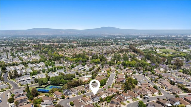 20 Whistling Isle, Irvine, CA 92614 - aerial view of property and surrounding area with a mountain backdrop and nearby suburban area