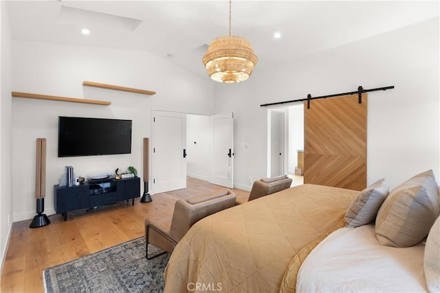 20 Whistling Isle, Irvine, CA 92614 - bedroom with vaulted ceiling, wood finished floors, a barn door, and a chandelier