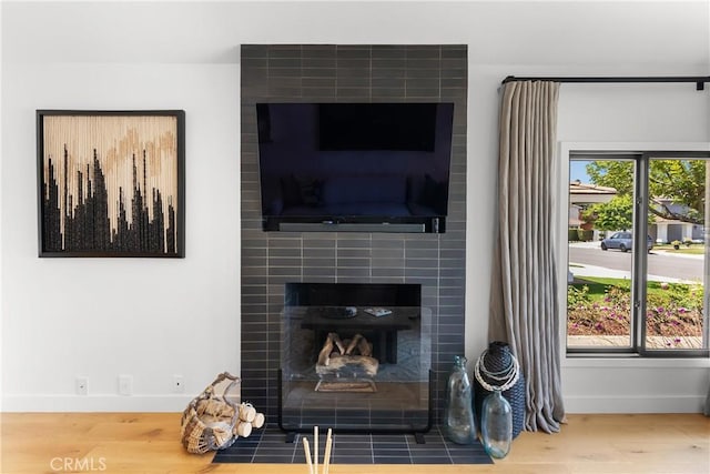 20 Whistling Isle, Irvine, CA 92614 - detailed view of wood finished floors and a tiled fireplace