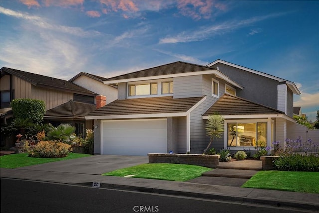 20 Whistling Isle, Irvine, CA 92614 - view of front of home featuring a garage, concrete driveway, and stucco siding