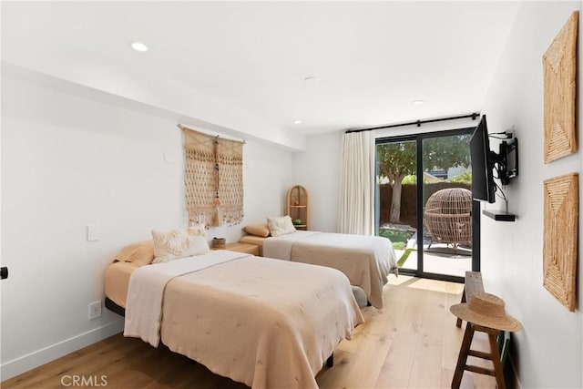 20 Whistling Isle, Irvine, CA 92614 - bedroom with access to outside, wood finished floors, and recessed lighting