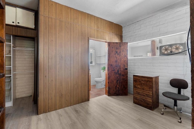 37882 Montezuma Valley Rd, Ranchita, CA 92066 - bedroom with wood finished floors, brick wall, and connected bathroom