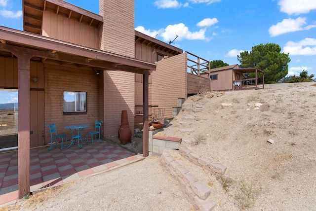 37882 Montezuma Valley Rd, Ranchita, CA 92066 - view of side of property with a patio area and a chimney