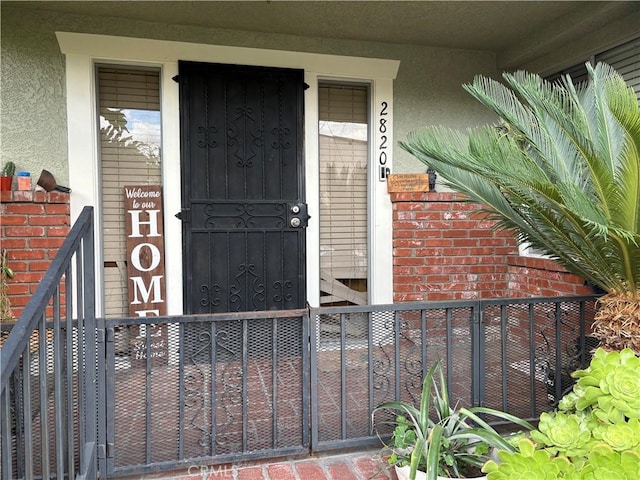 2820 E 6th St, Los Angeles, CA 90023 - doorway to property featuring stucco siding