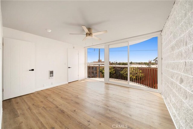 240 W Queen St Unit 10, Inglewood, CA 90301 - empty room featuring ceiling fan, wood finished floors, and floor to ceiling windows