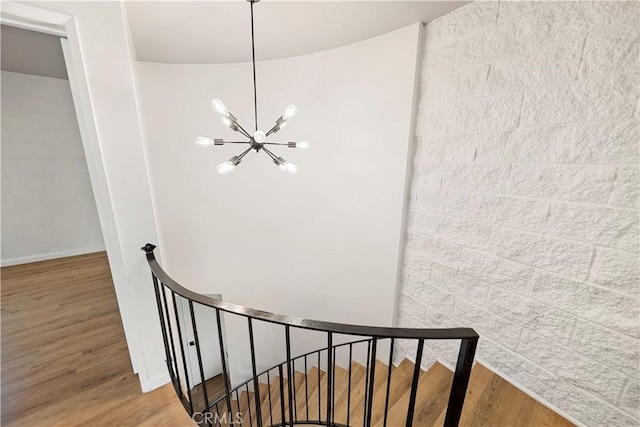 240 W Queen St Unit 10, Inglewood, CA 90301 - stairway featuring a chandelier and wood finished floors