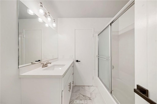 240 W Queen St Unit 10, Inglewood, CA 90301 - full bathroom with marble finish floors, vanity, and bath / shower combo with glass door
