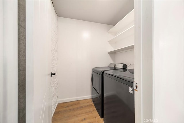 240 W Queen St Unit 10, Inglewood, CA 90301 - washroom with washer and dryer and light wood-style floors
