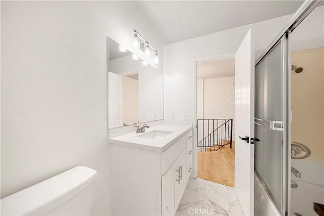 240 W Queen St Unit 10, Inglewood, CA 90301 - bathroom with marble look tile flooring, vanity, and bath / shower combo with glass door